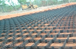 Geocell panels being installed and filled with laterite on-site